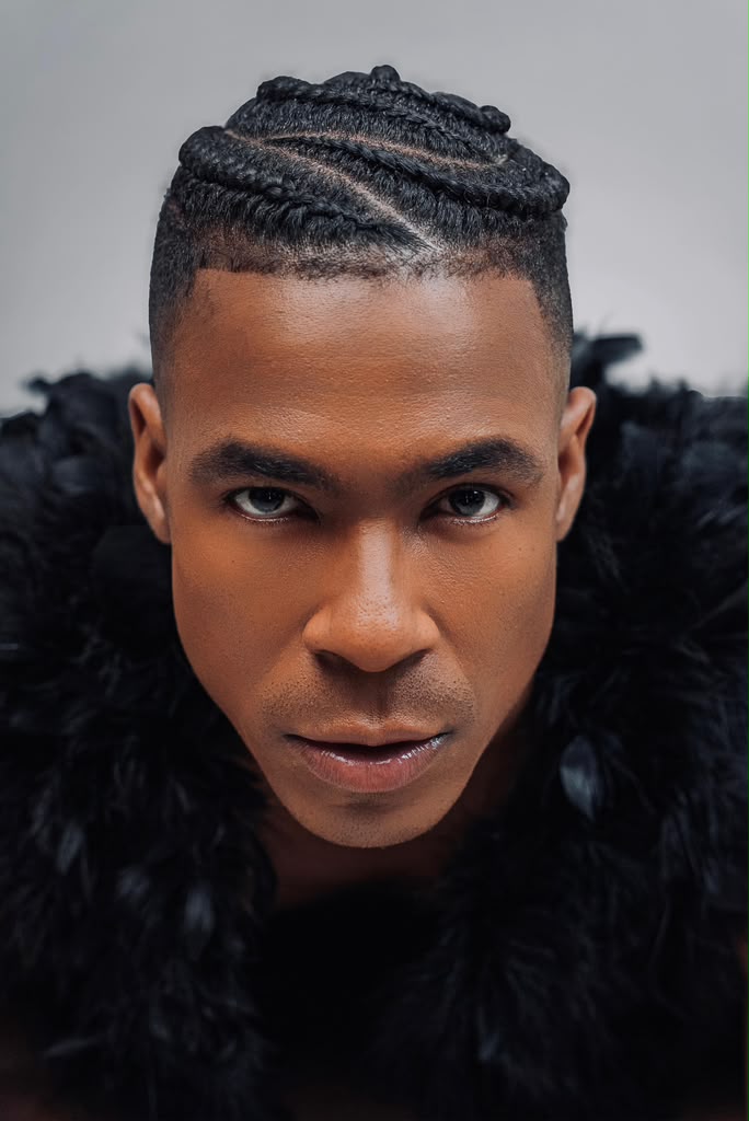Male portrait with cornrows and fade haircut